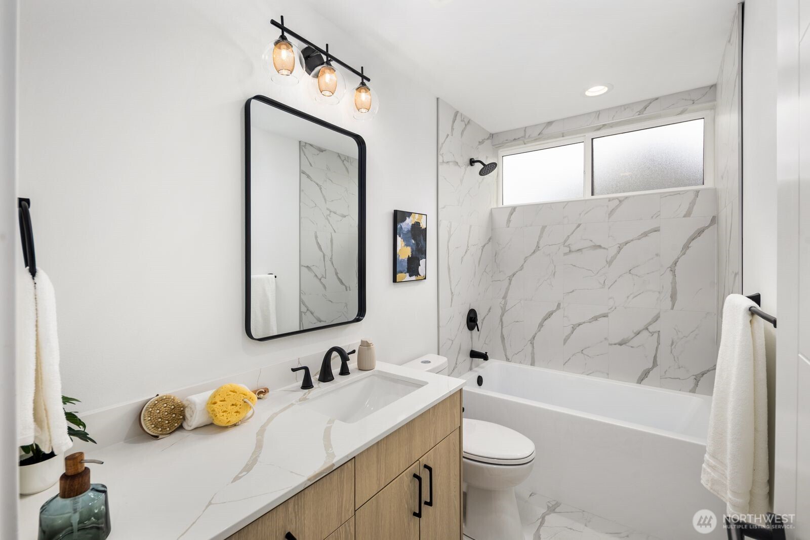 520 North 102nd Street Seattle, WA 98133 - Photo 18 of 20 a bathroom with a sink and a mirror