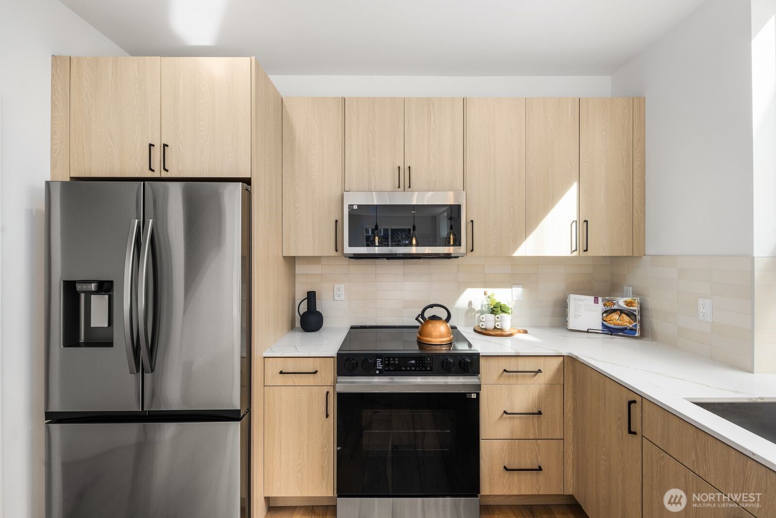 520 North 102nd Street Seattle, WA 98133 - Photo 9 of 20 a kitchen with a refrigerator sink and cabinets