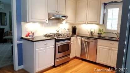 225 Pine Street Fort Mill, SC 29715 - Photo 11 of 40 a kitchen with stainless steel appliances granite countertop a sink stove and cabinets