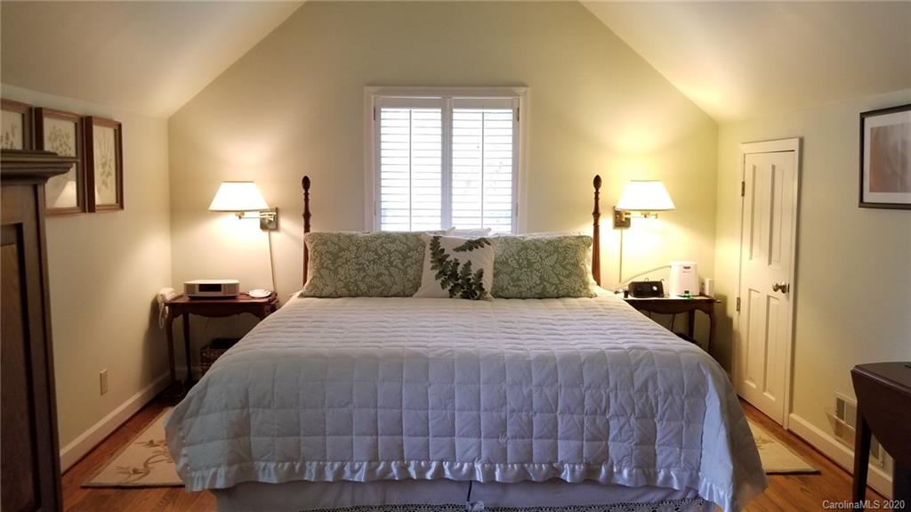 225 Pine Street Fort Mill, SC 29715 - Photo 19 of 40 a bedroom with a bed and a lamp