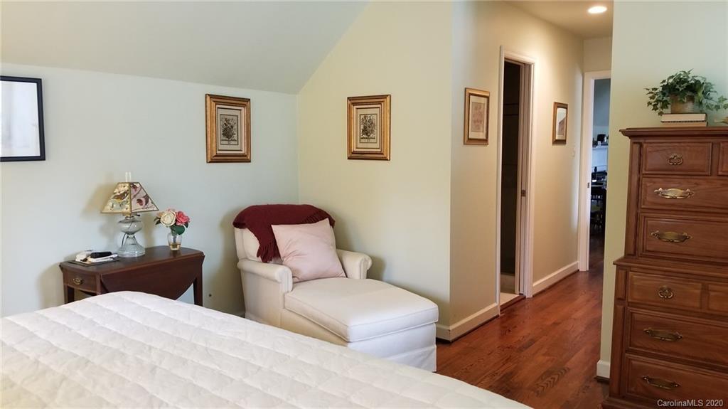 225 Pine Street Fort Mill, SC 29715 - Photo 21 of 40 a bedroom with a bed and wooden floor