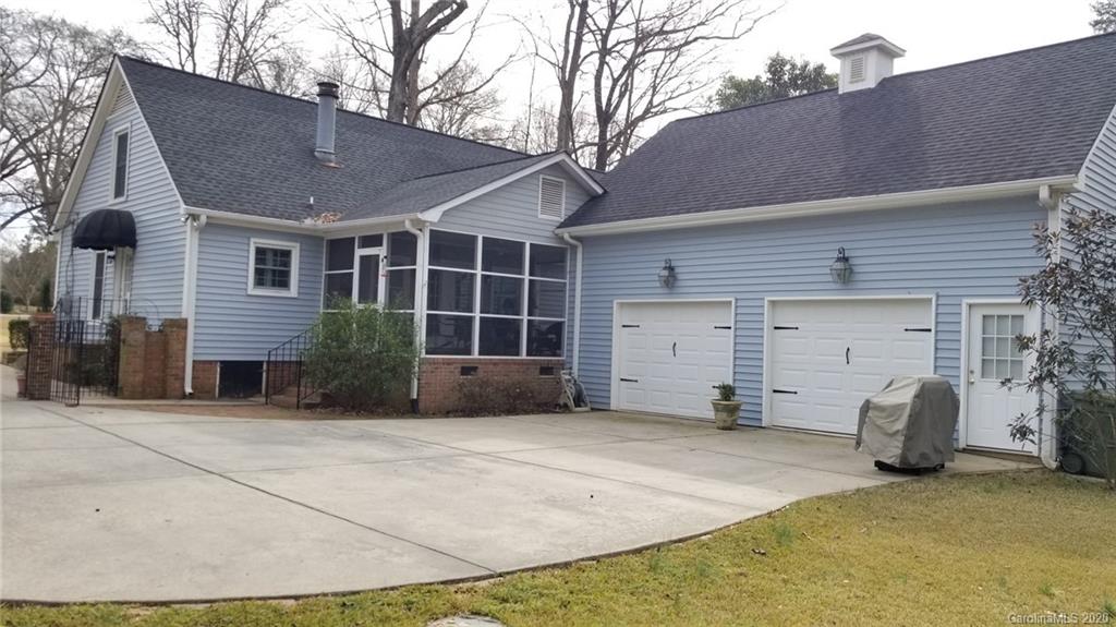 225 Pine Street Fort Mill, SC 29715 - Photo 36 of 40 a view of a house with a yard and garage