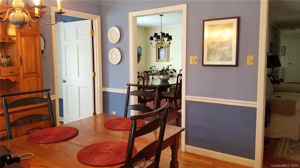 225 Pine Street Fort Mill, SC 29715 - Photo 5 of 40 a view of a dining room with furniture and wooden floor