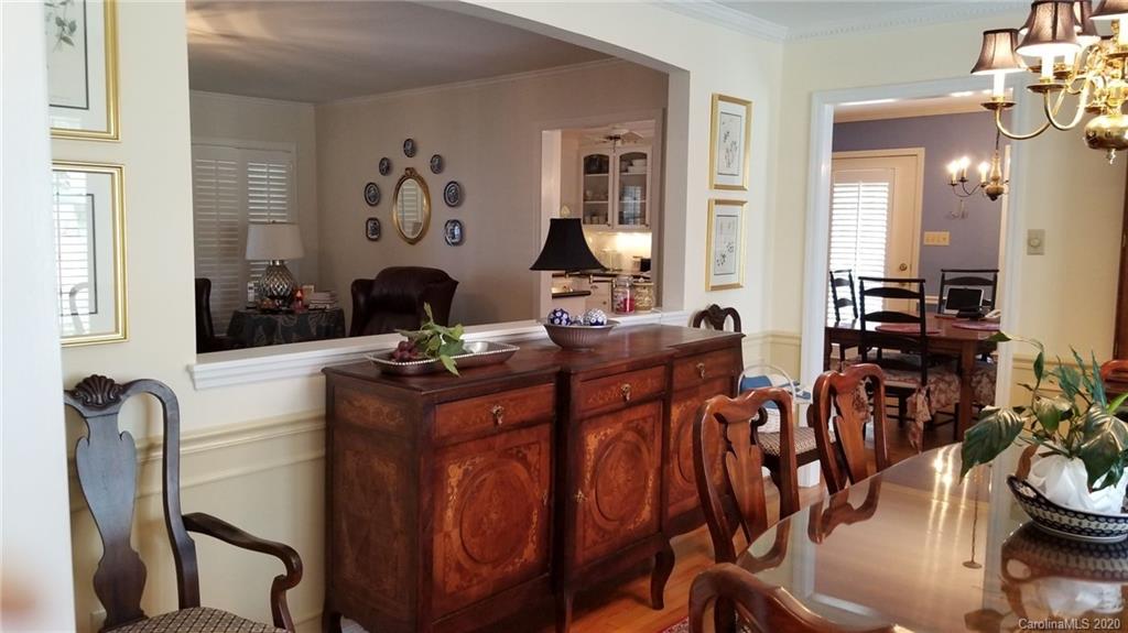 225 Pine Street Fort Mill, SC 29715 - Photo 7 of 40 a living room with furniture a rug and a chandelier