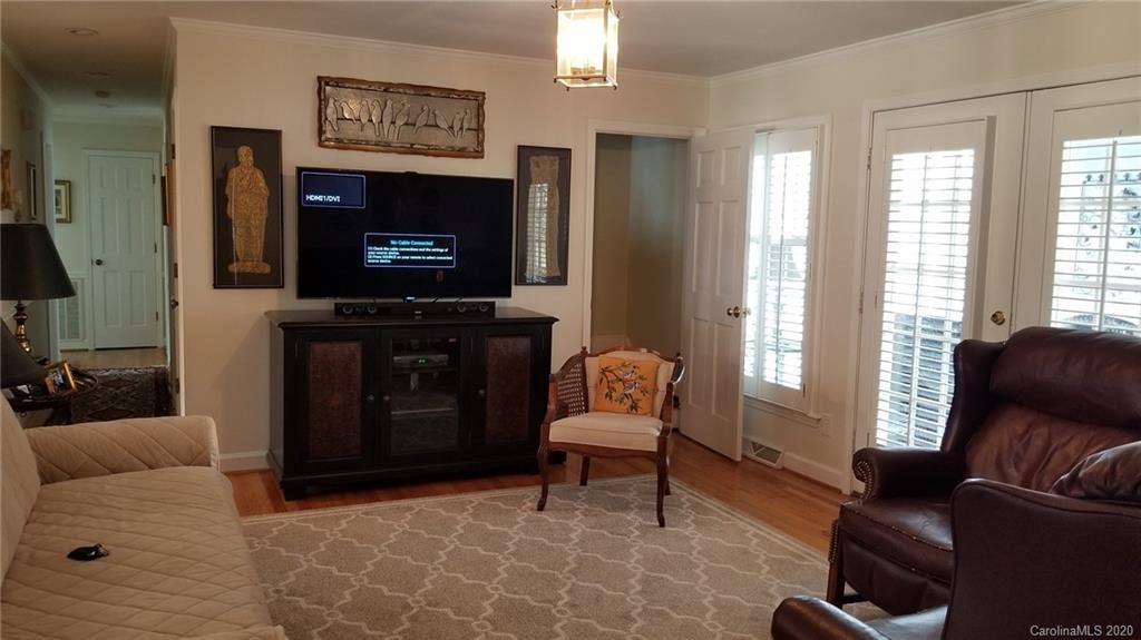 225 Pine Street Fort Mill, SC 29715 - Photo 10 of 40 a living room with furniture a flat screen tv and a fireplace