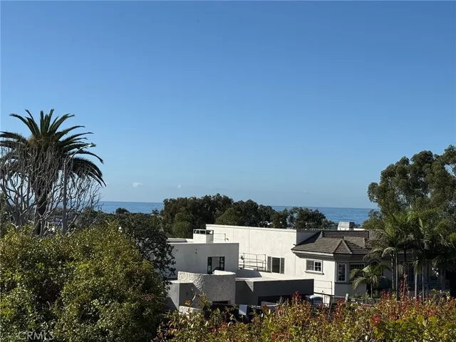 a view of a house with a yard and balcony
