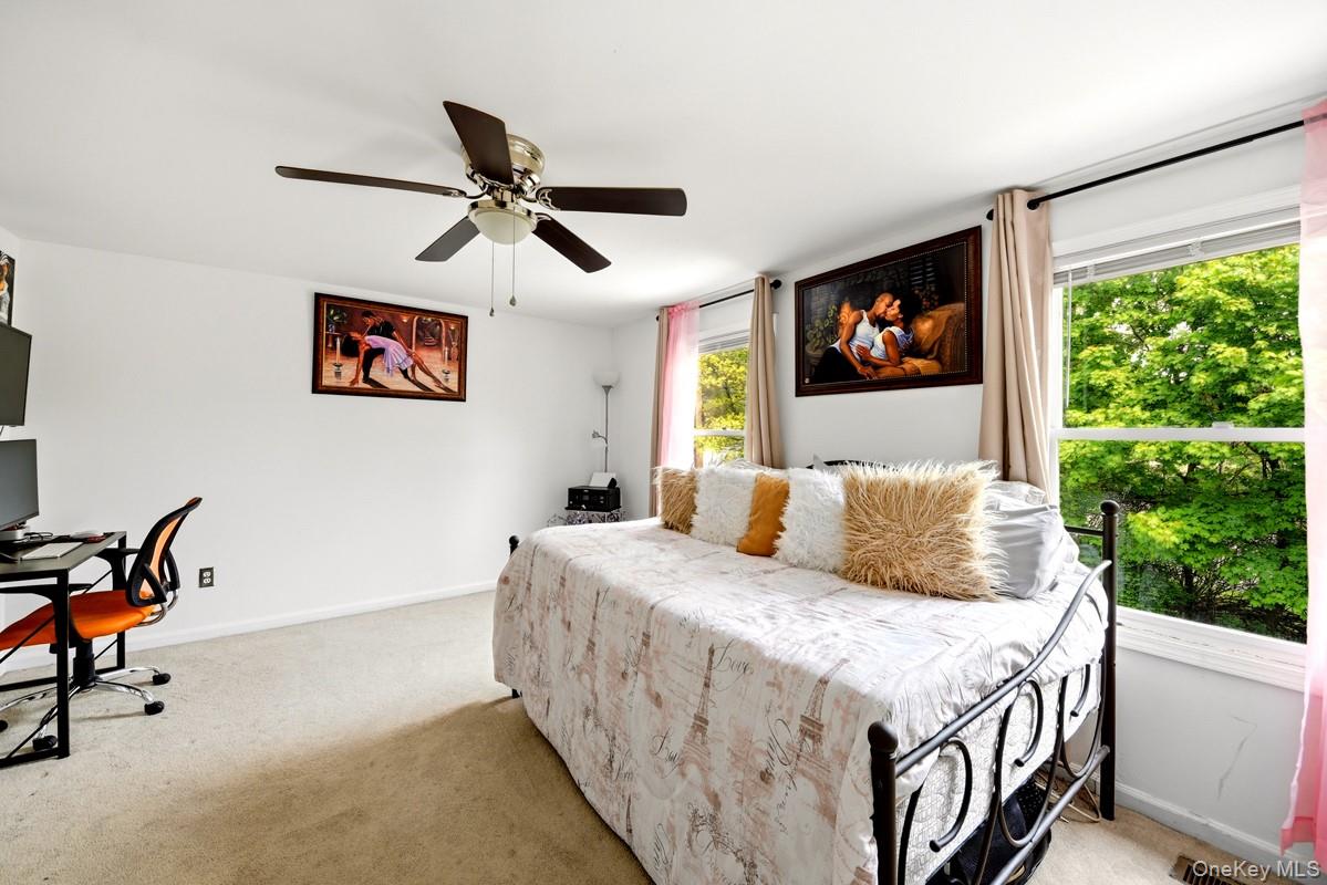 708 Mallard Way Peekskill, NY 10566 - Photo 21 of 29 a bedroom with a bed and a window