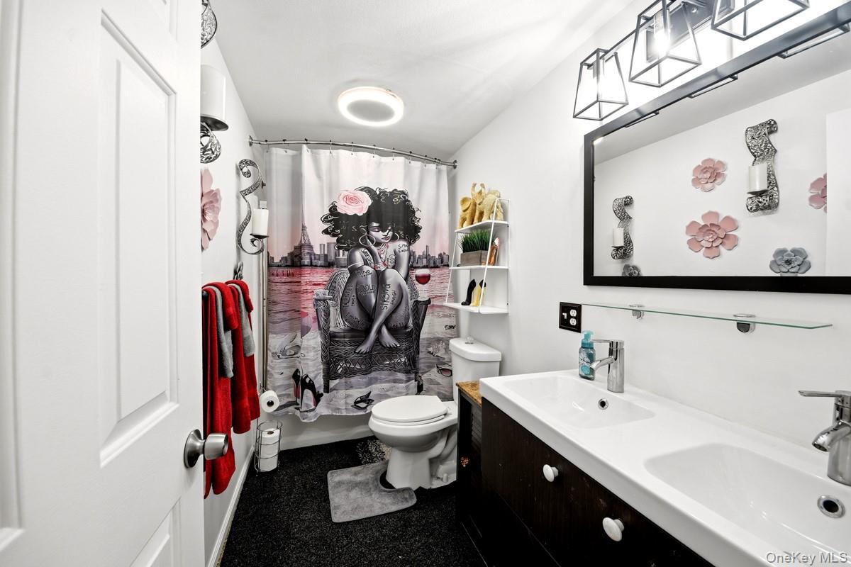 708 Mallard Way Peekskill, NY 10566 - Photo 23 of 29 a bathroom with a sink toilet and shower