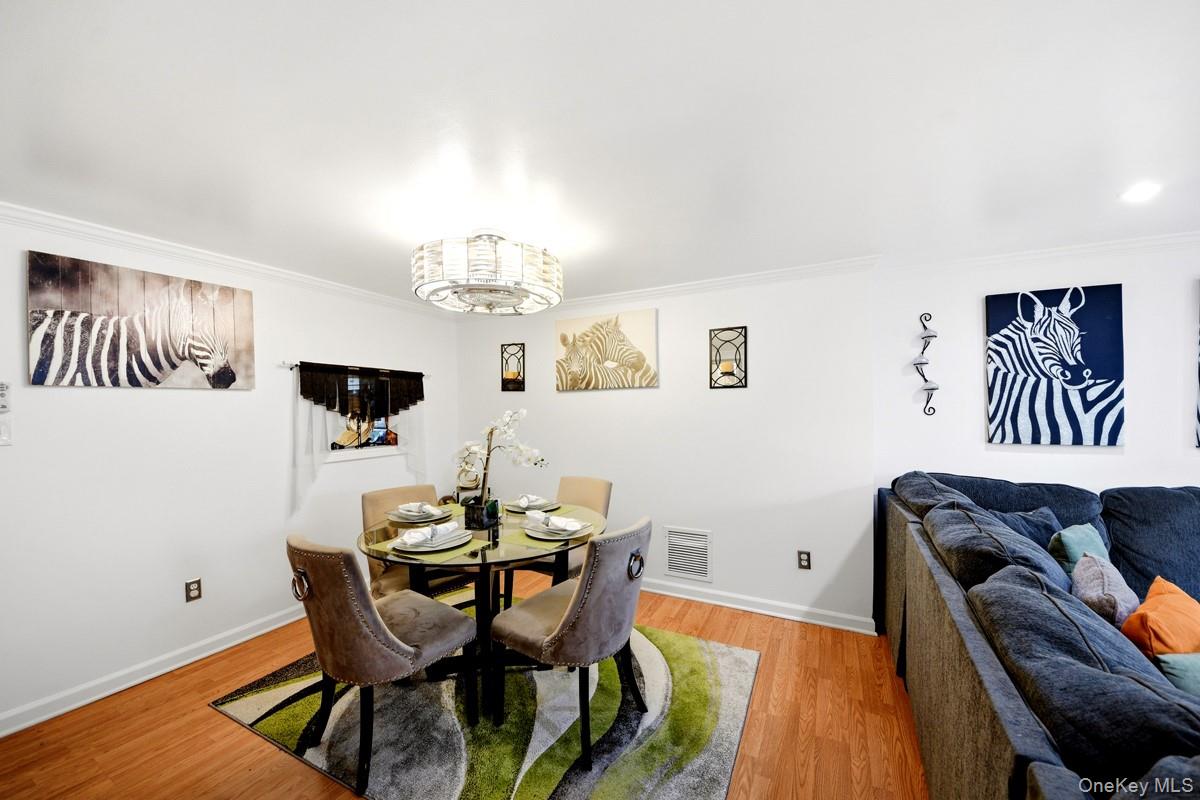 708 Mallard Way Peekskill, NY 10566 - Photo 5 of 29 a view of a dining room with furniture and chandelier