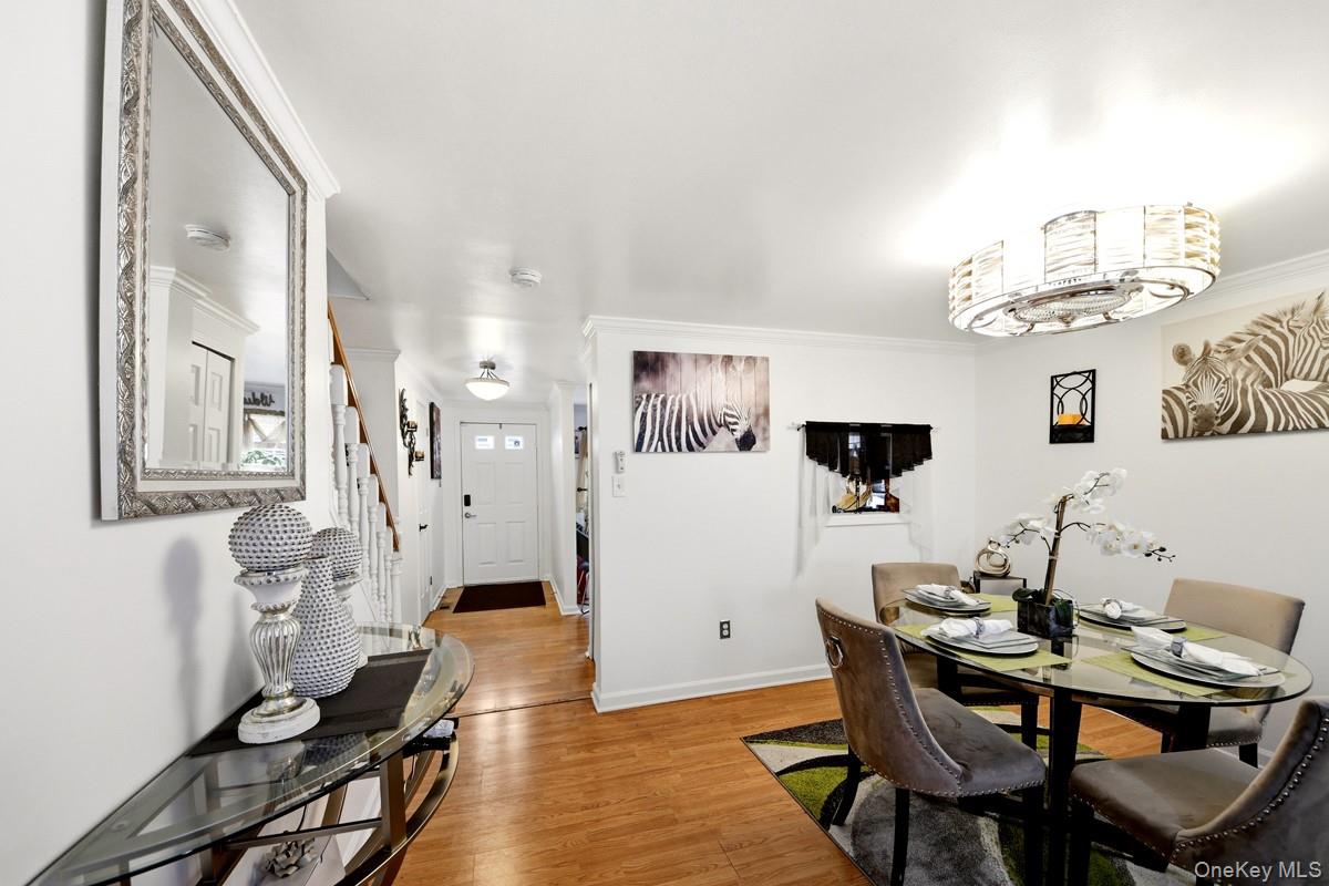 708 Mallard Way Peekskill, NY 10566 - Photo 6 of 29 a view of a dining room with furniture and chandelier