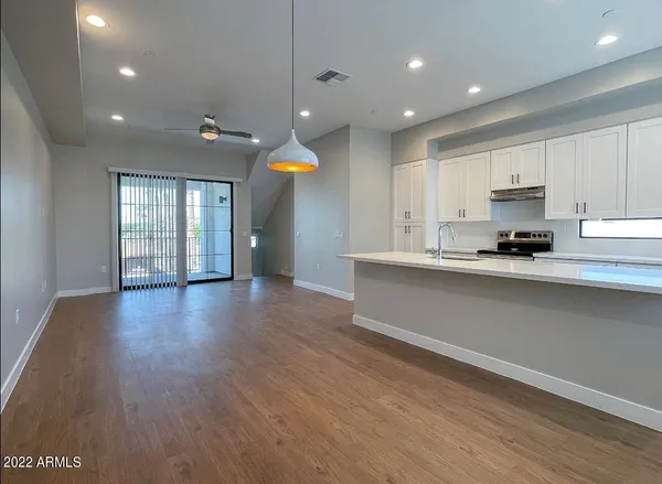 a kitchen with a stove and a microwave