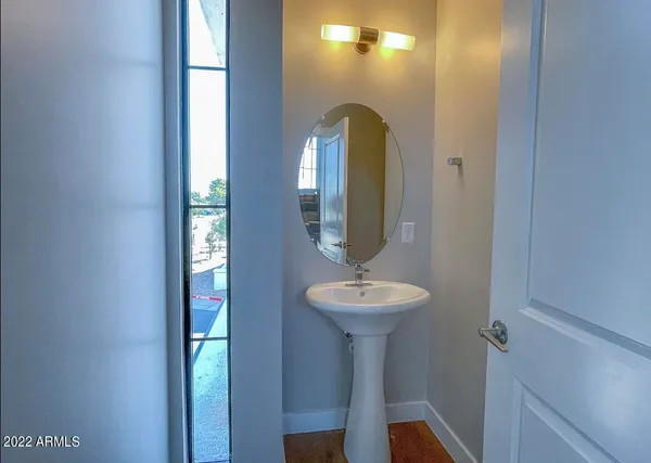 a bathroom with a sink a toilet and vanity