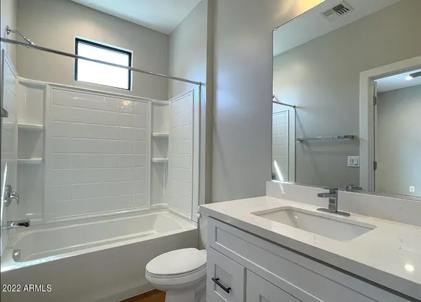 a bathroom with a bathtub and a sink