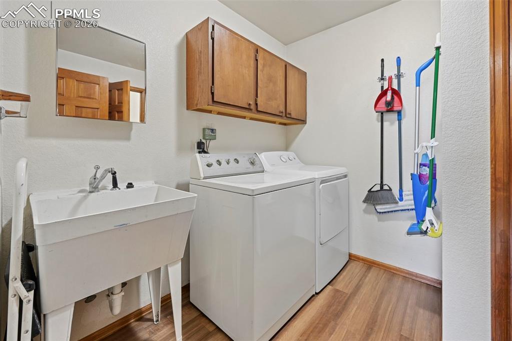 14775 Judge Orr Road Peyton, CO 80831 - Photo 11 of 49 Laundry Room-Gas Dryer/Wash out sink and Linen Closet