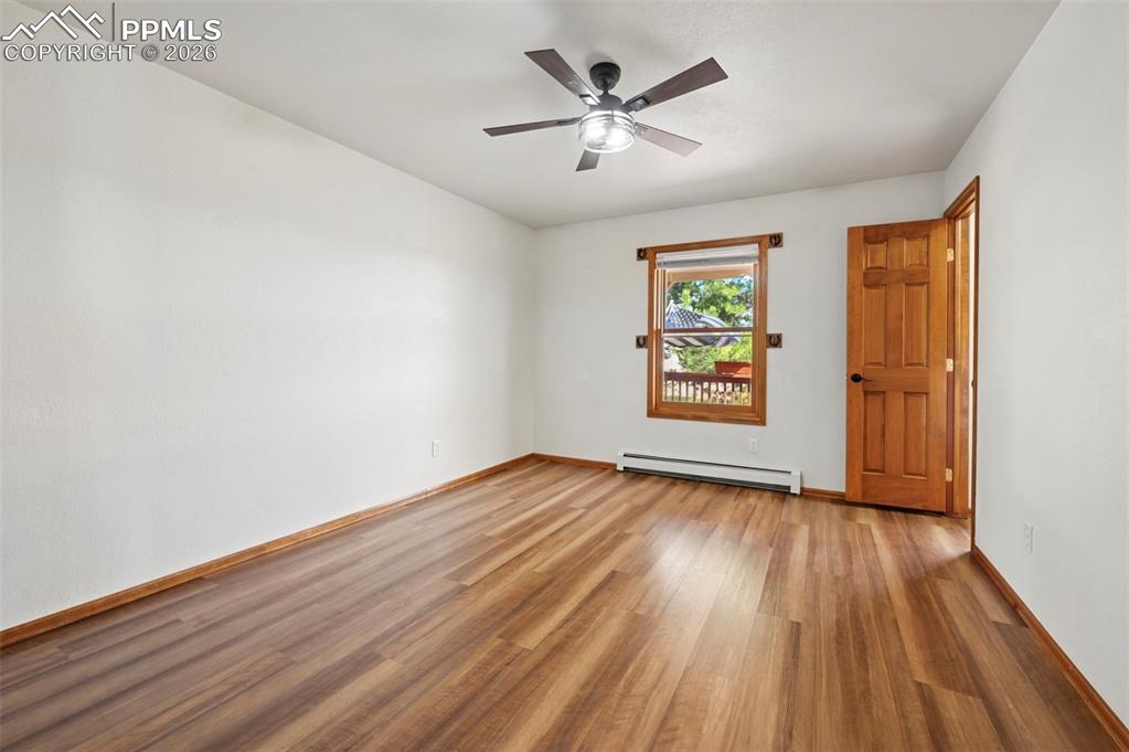 14775 Judge Orr Road Peyton, CO 80831 - Photo 22 of 49 Bedroom #1 New LVP flooring- Walk in Closet! Heating system is hot water thermostat zoned through out house and garage.