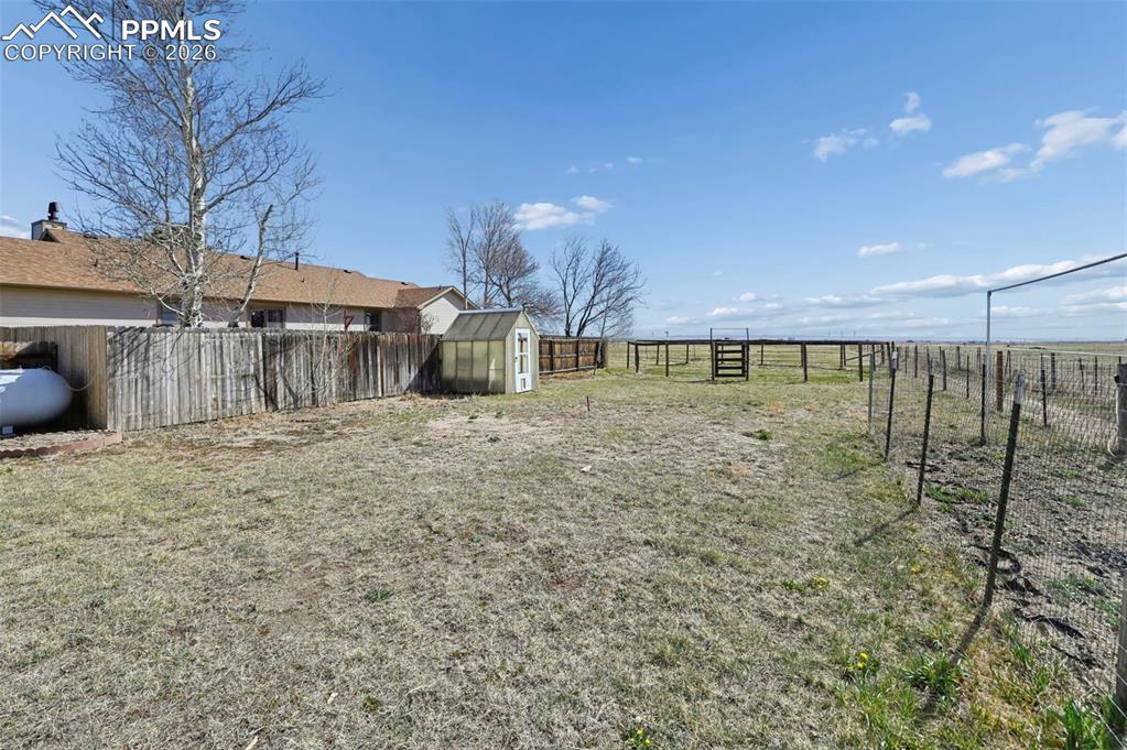 14775 Judge Orr Road Peyton, CO 80831 - Photo 33 of 49 2nd Yard-GreenHouse with electric and automatic mister