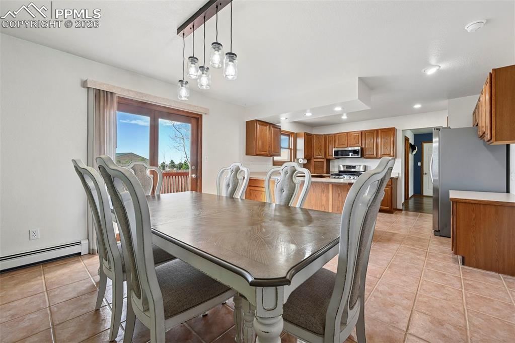 14775 Judge Orr Road Peyton, CO 80831 - Photo 6 of 49 Open Floor Plan Country Style Kitchen