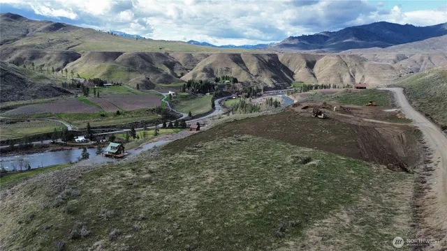a view of a town with mountains in the background