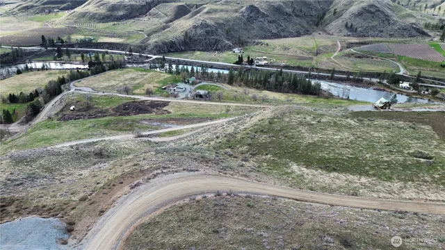 a view of a backyard with swimming pool