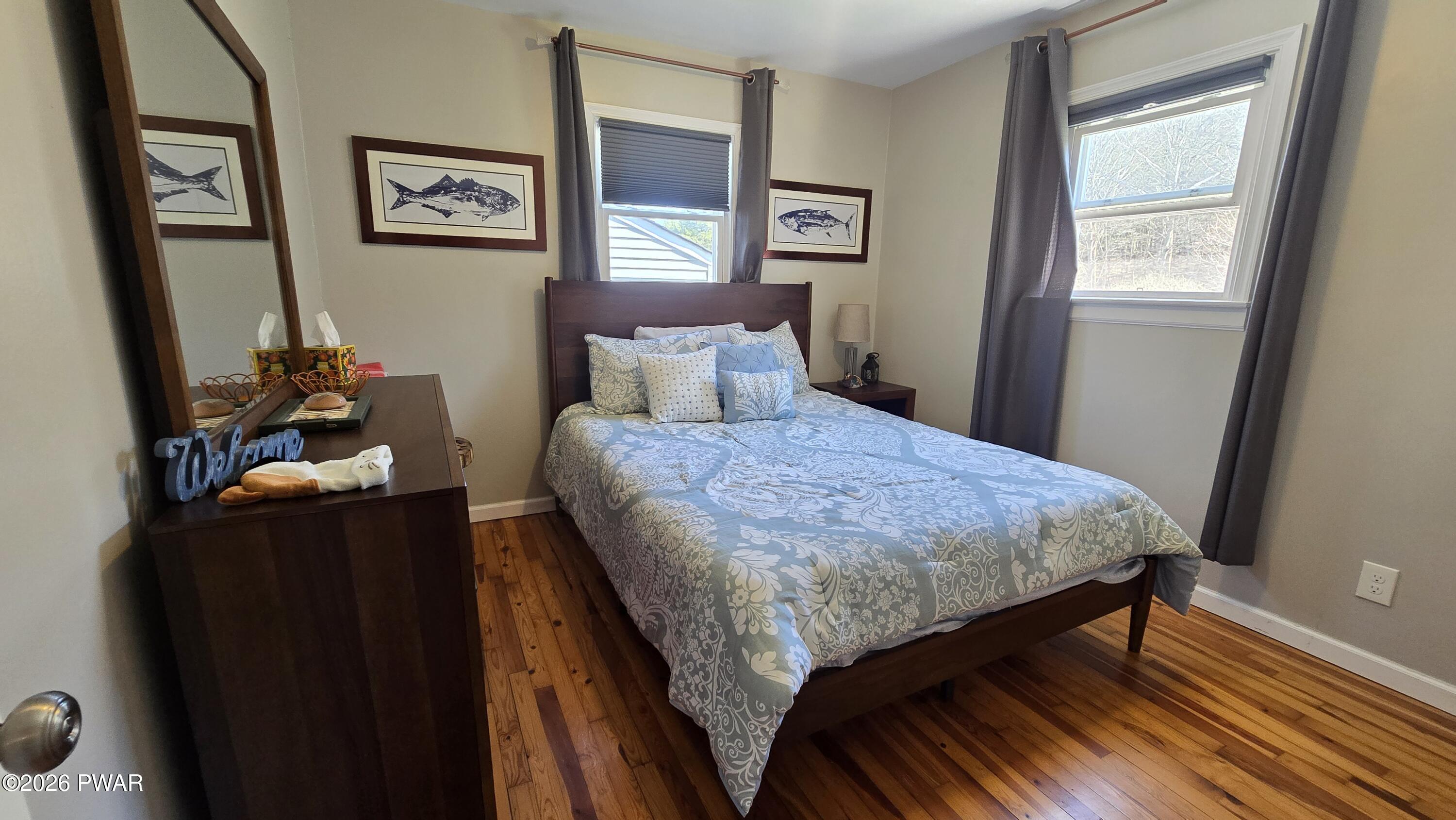 430 Griffith Road Tyler Hill, PA 18469 - Photo 13 of 31 a bedroom with a bed and a dresser next to a window