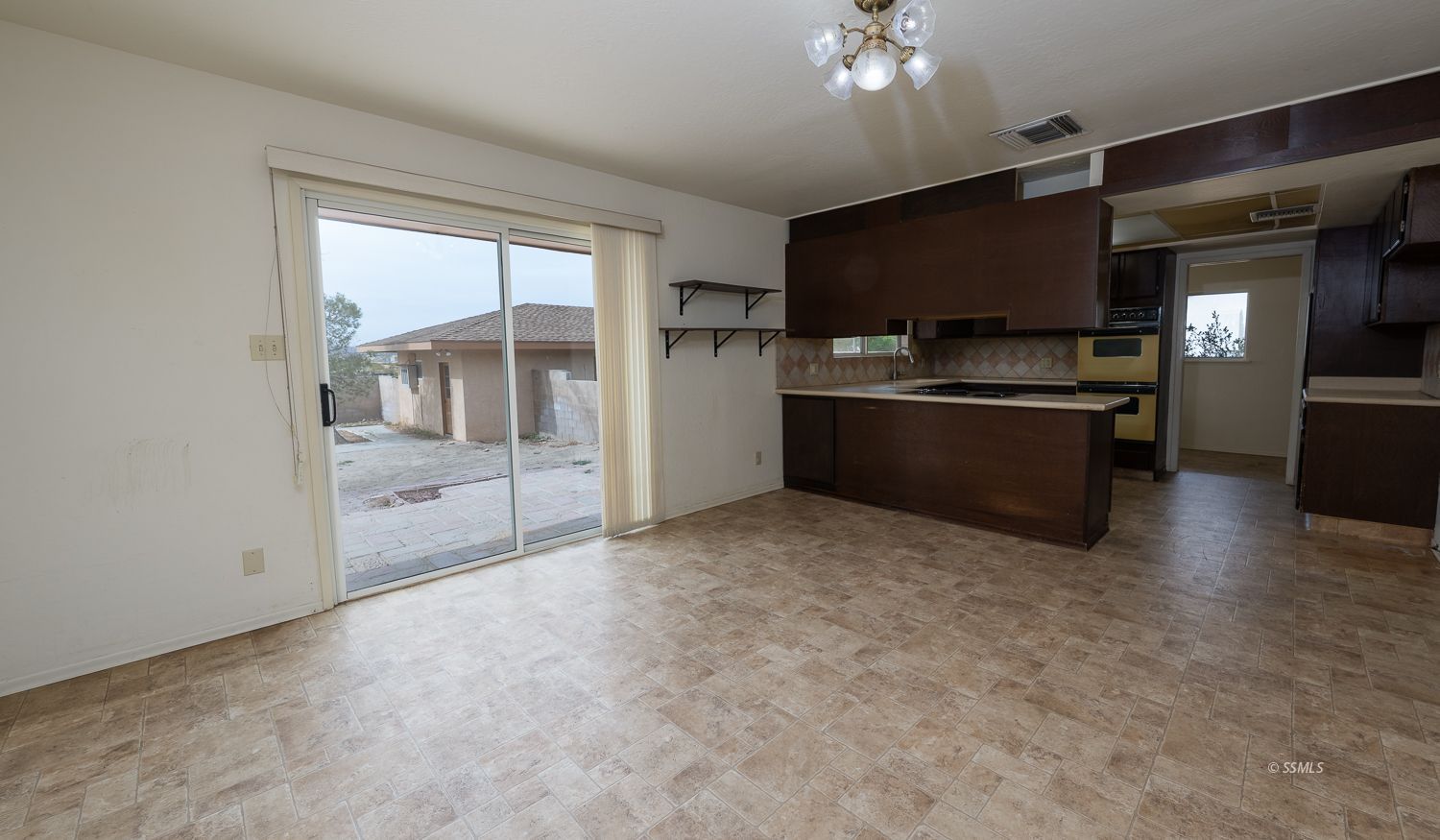 1313 Autumn Avenue Ridgecrest, CA 93555 - Photo 6 of 50 a large kitchen with stainless steel appliances a large counter top