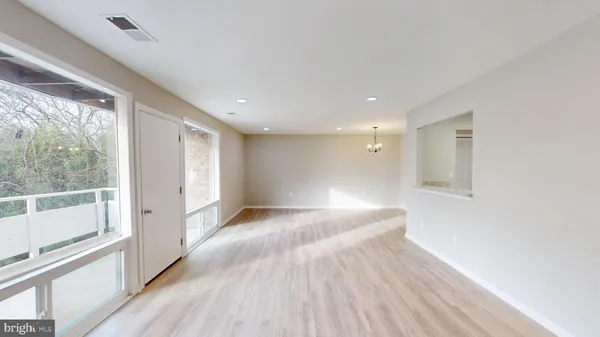 a view of a livingroom with wooden floor
