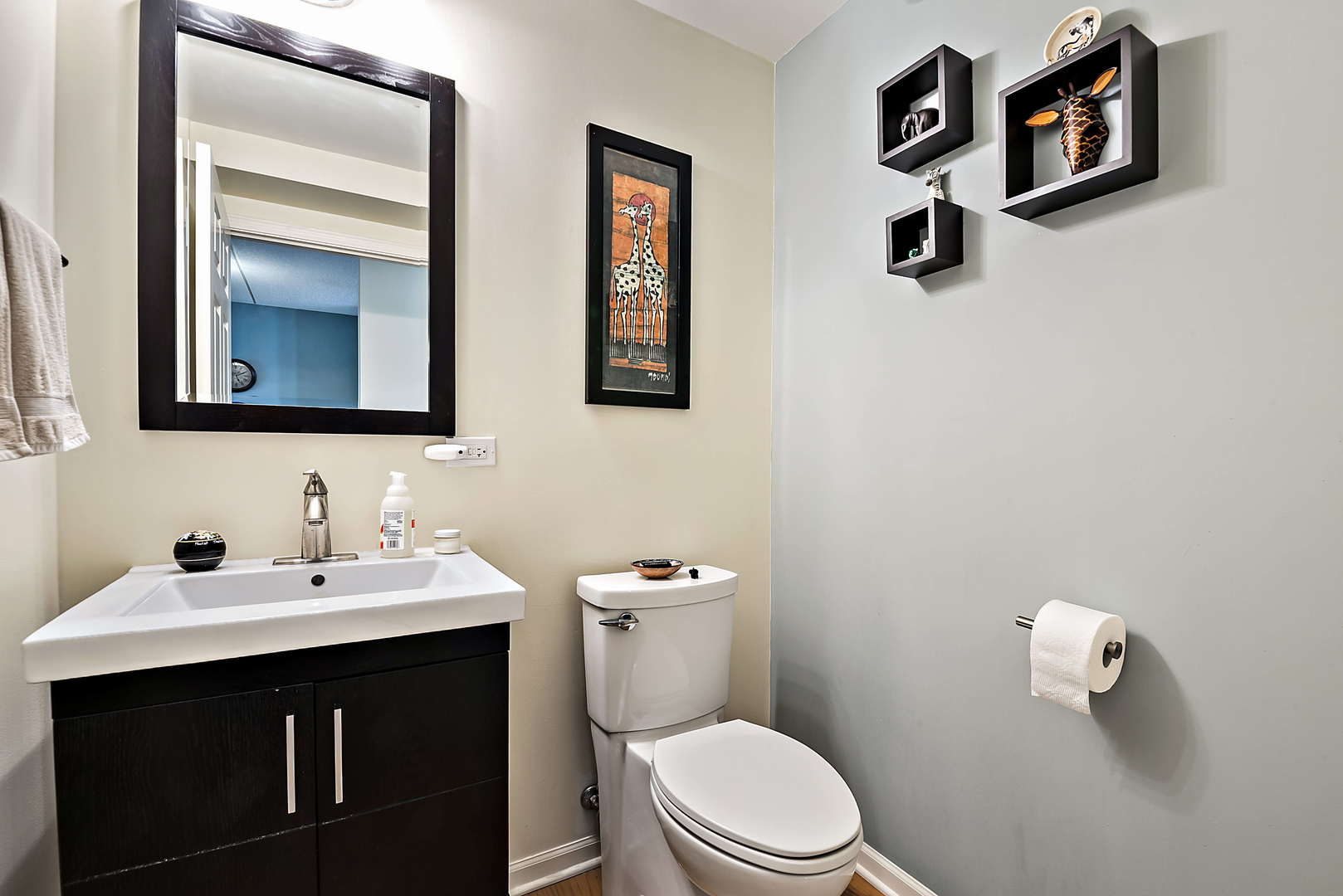 440 West Mahogany Court, Unit 208 Palatine, IL 60067 - Photo 13 of 16 a bathroom with a toilet sink and mirror