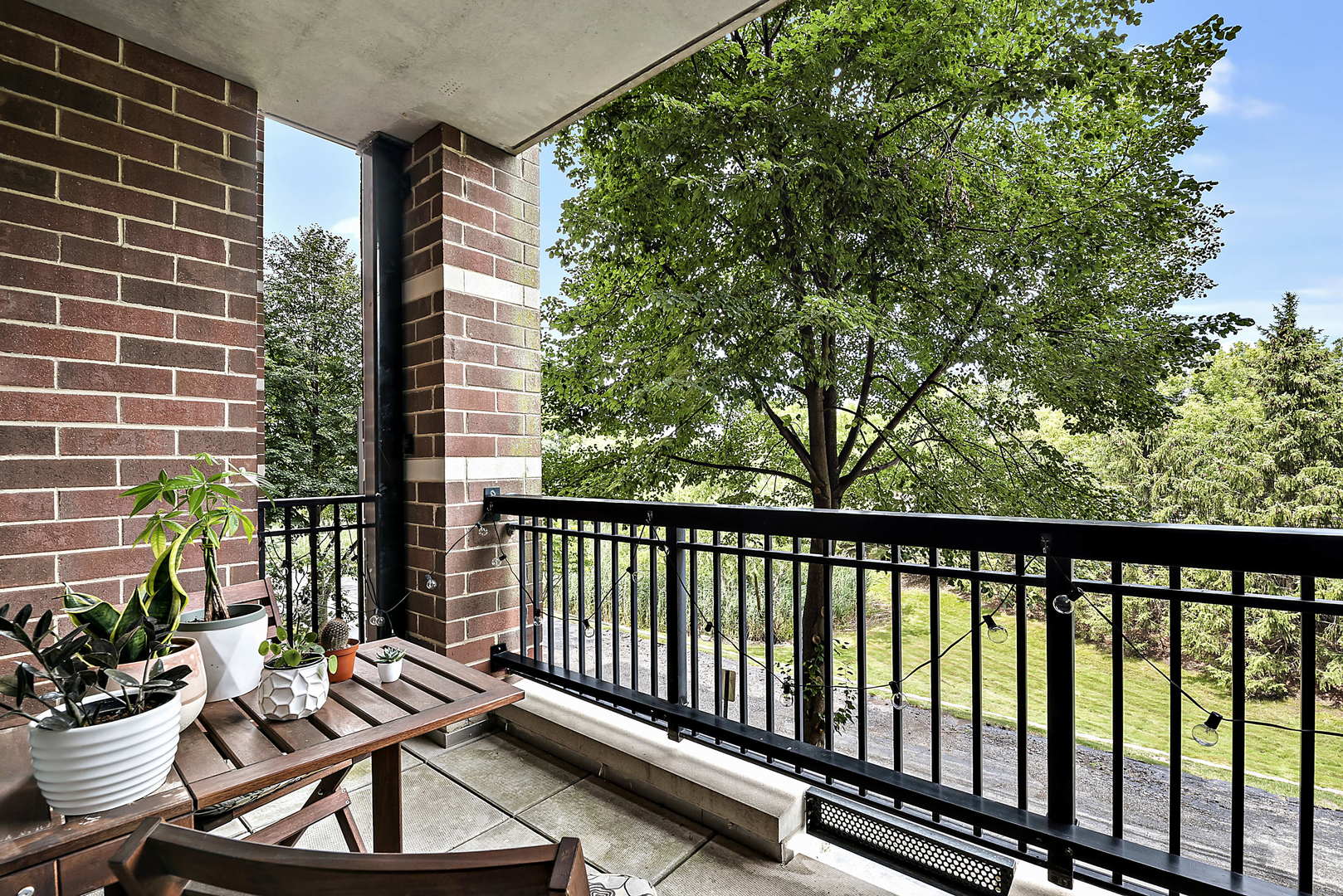 440 West Mahogany Court, Unit 208 Palatine, IL 60067 - Photo 15 of 16 a balcony with chairs