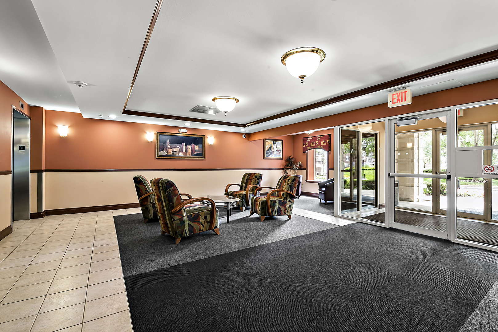 440 West Mahogany Court, Unit 208 Palatine, IL 60067 - Photo 2 of 16 a lobby with furniture and a table