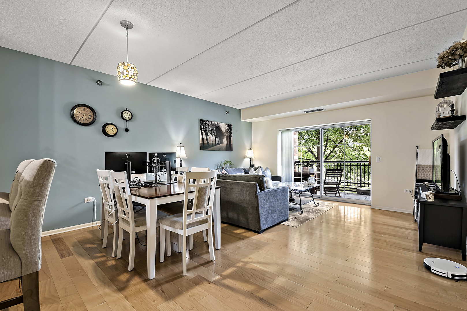 440 West Mahogany Court, Unit 208 Palatine, IL 60067 - Photo 6 of 16 a view of a dining room with furniture window and wooden floor