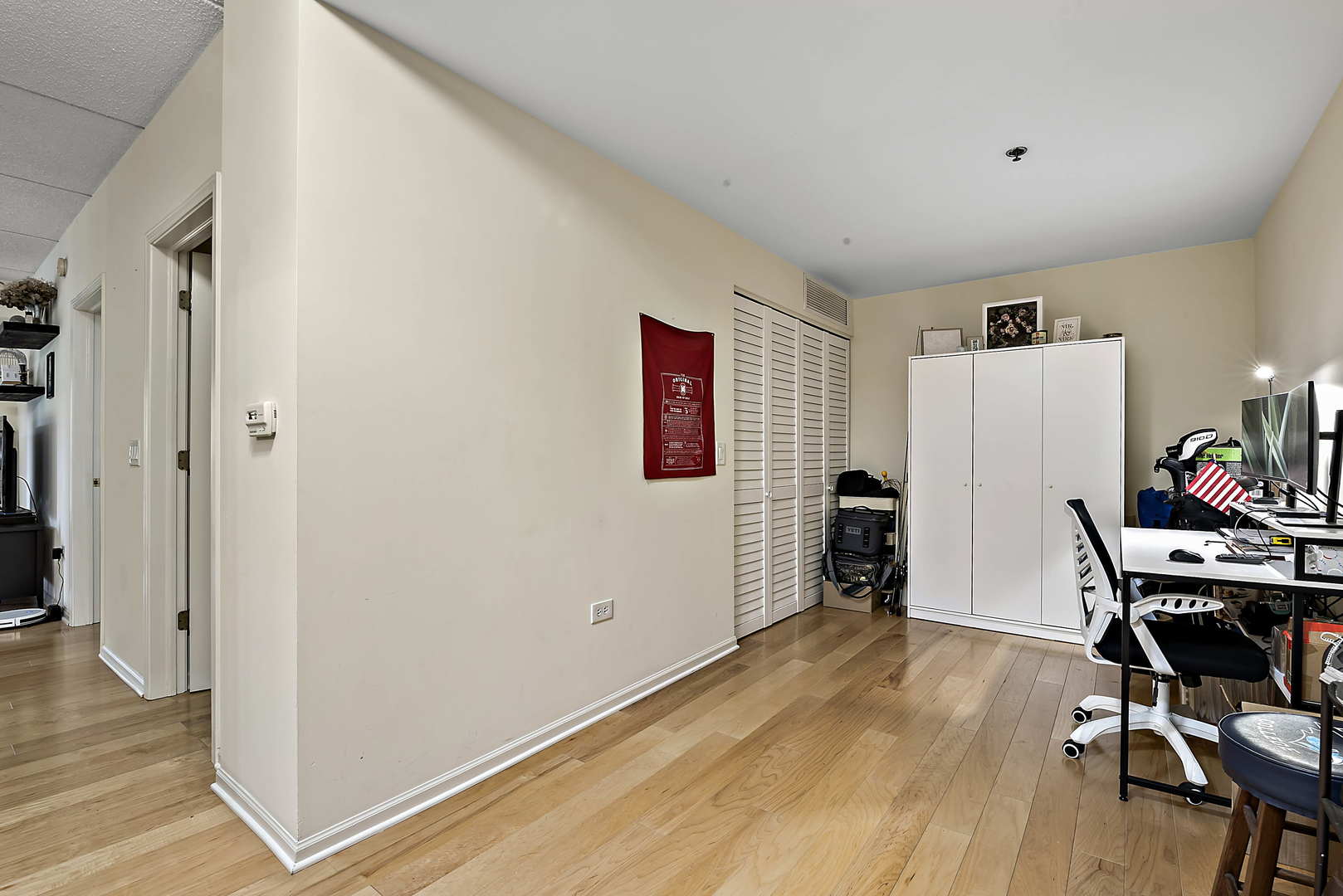 440 West Mahogany Court, Unit 208 Palatine, IL 60067 - Photo 9 of 16 a view of a workspace with furniture and wooden floor