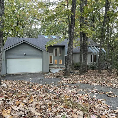 a house with trees in the background