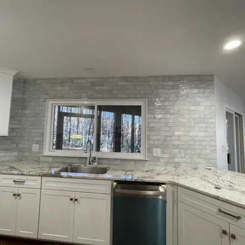 a kitchen with a sink and cabinets