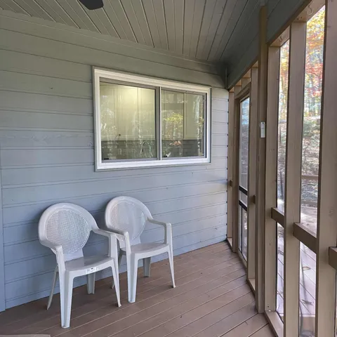a dining room with furniture and windows
