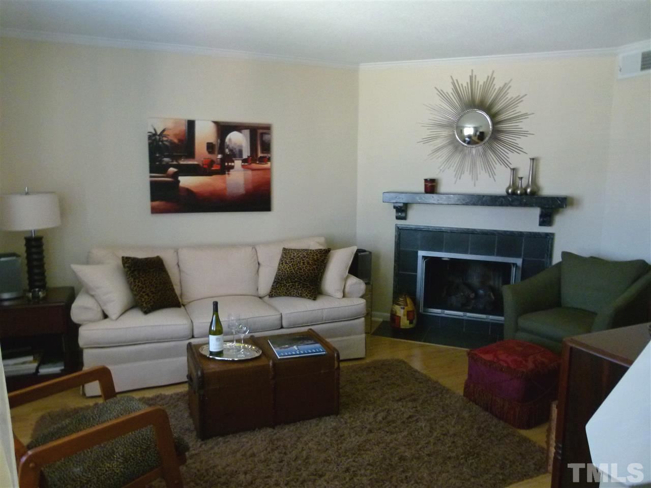 6967 Staghorn Lane Raleigh, NC 27615 - Photo 11 of 11 a living room with furniture and a fireplace
