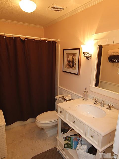 6967 Staghorn Lane Raleigh, NC 27615 - Photo 7 of 11 a bathroom with a sink and a mirror