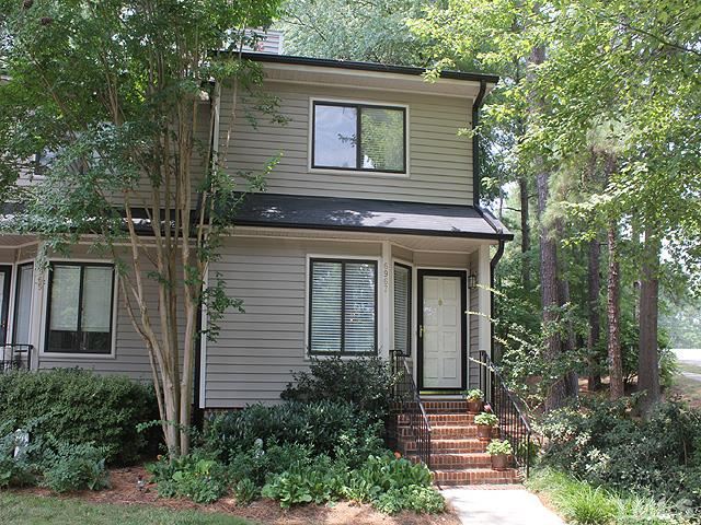 6967 Staghorn Lane Raleigh, NC 27615 - Photo 10 of 11 a front view of a house with plants