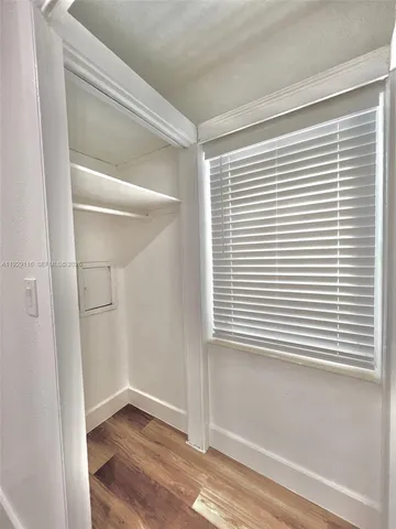 a view of a room that has a window in it
