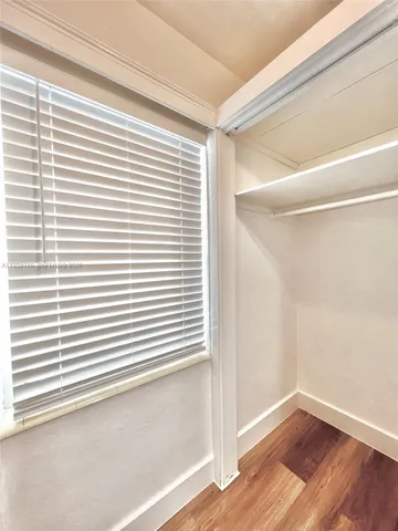 a view of a room that has a window in it