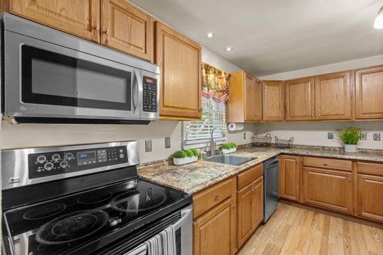 2050 Township Road Monroeville, PA 15146 - Photo 12 of 25 a kitchen with a stove a sink and a microwave