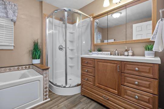 2050 Township Road Monroeville, PA 15146 - Photo 17 of 25 a bathroom with a tub a sink and mirror