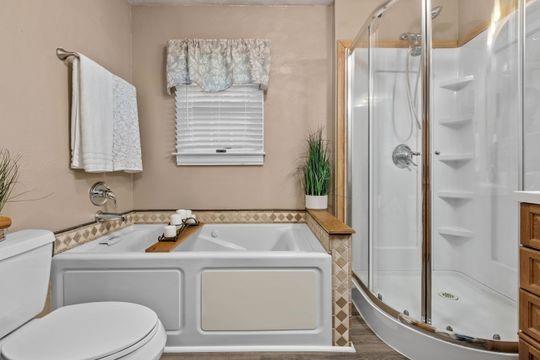 2050 Township Road Monroeville, PA 15146 - Photo 18 of 25 a bathroom with a bathtub and a shower