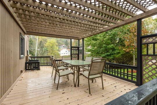 2050 Township Road Monroeville, PA 15146 - Photo 4 of 25 a patio with wooden floor a yard tables and chairs