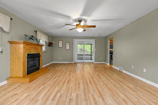 2050 Township Road Monroeville, PA 15146 - Photo 7 of 25 a view of empty room with a fireplace and fan