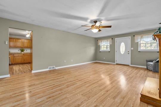 2050 Township Road Monroeville, PA 15146 - Photo 9 of 25 a view of empty room with wooden floor and fan