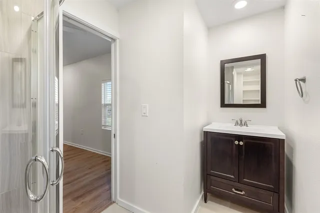 a bathroom with a sink and a mirror