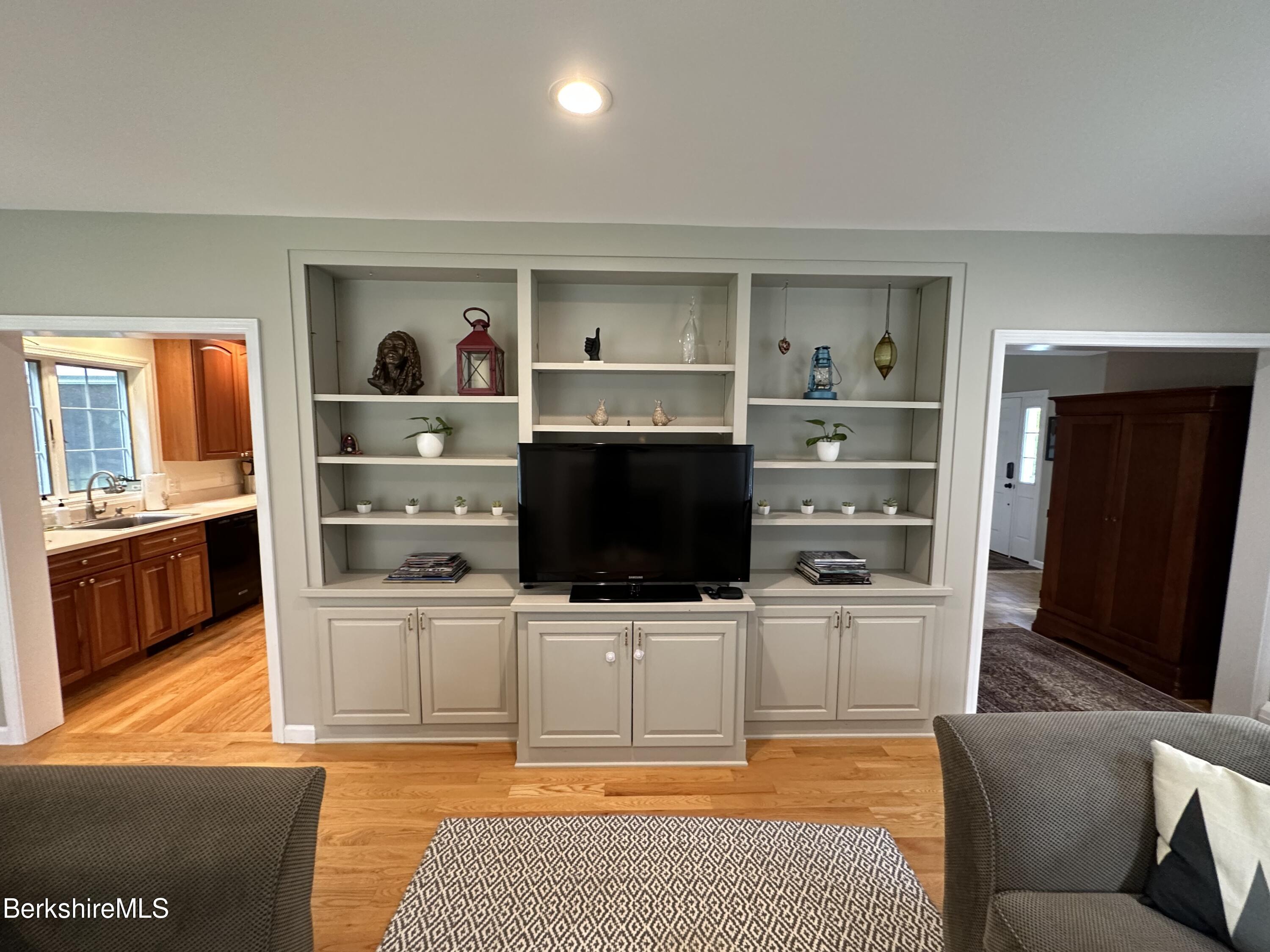 199 Old Post Road Richmond, MA 01201 - Photo 12 of 40 a living room with stainless steel appliances kitchen island granite countertop a refrigerator and a stove top oven