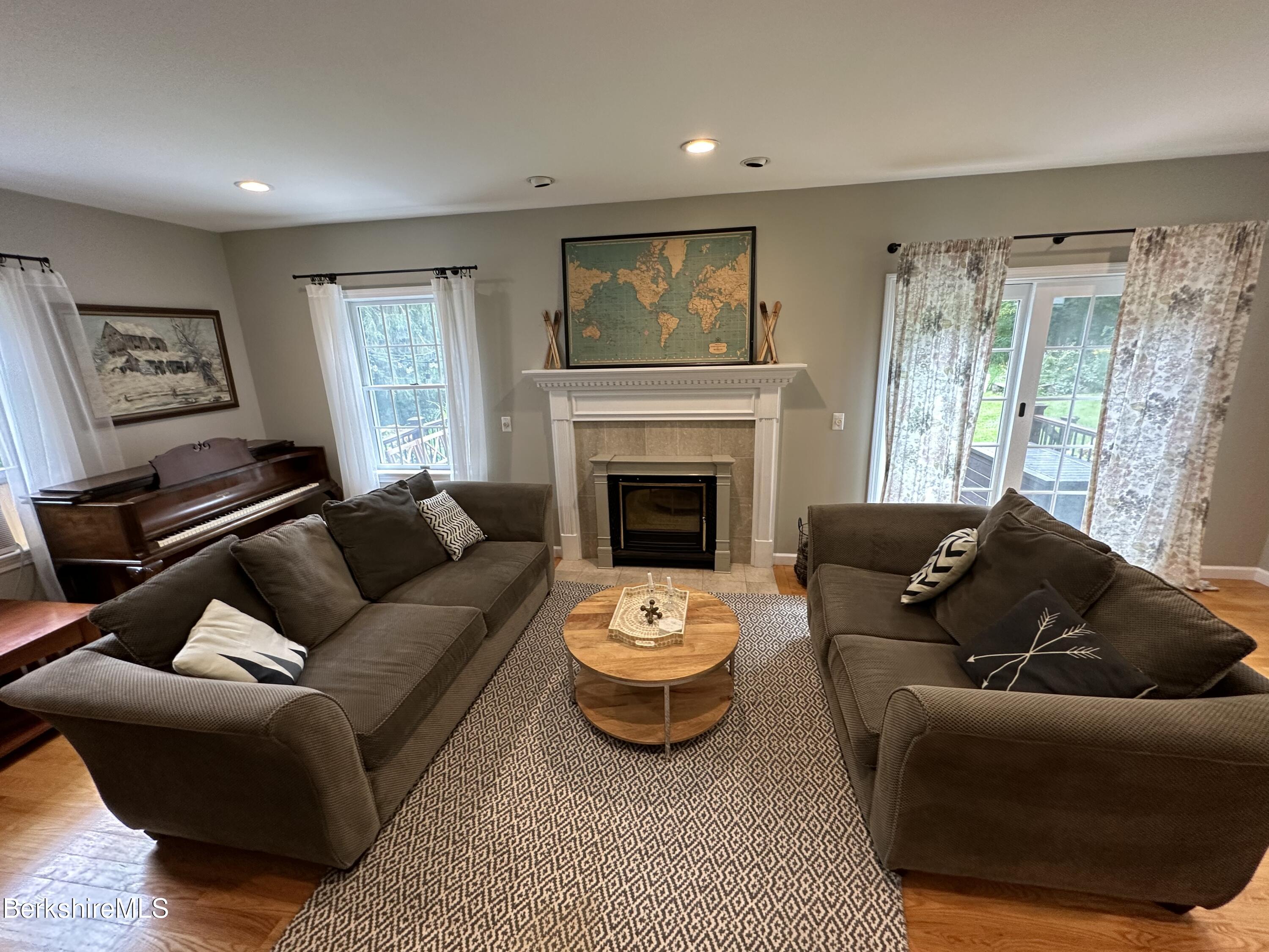 199 Old Post Road Richmond, MA 01201 - Photo 13 of 40 a living room with furniture and a fireplace
