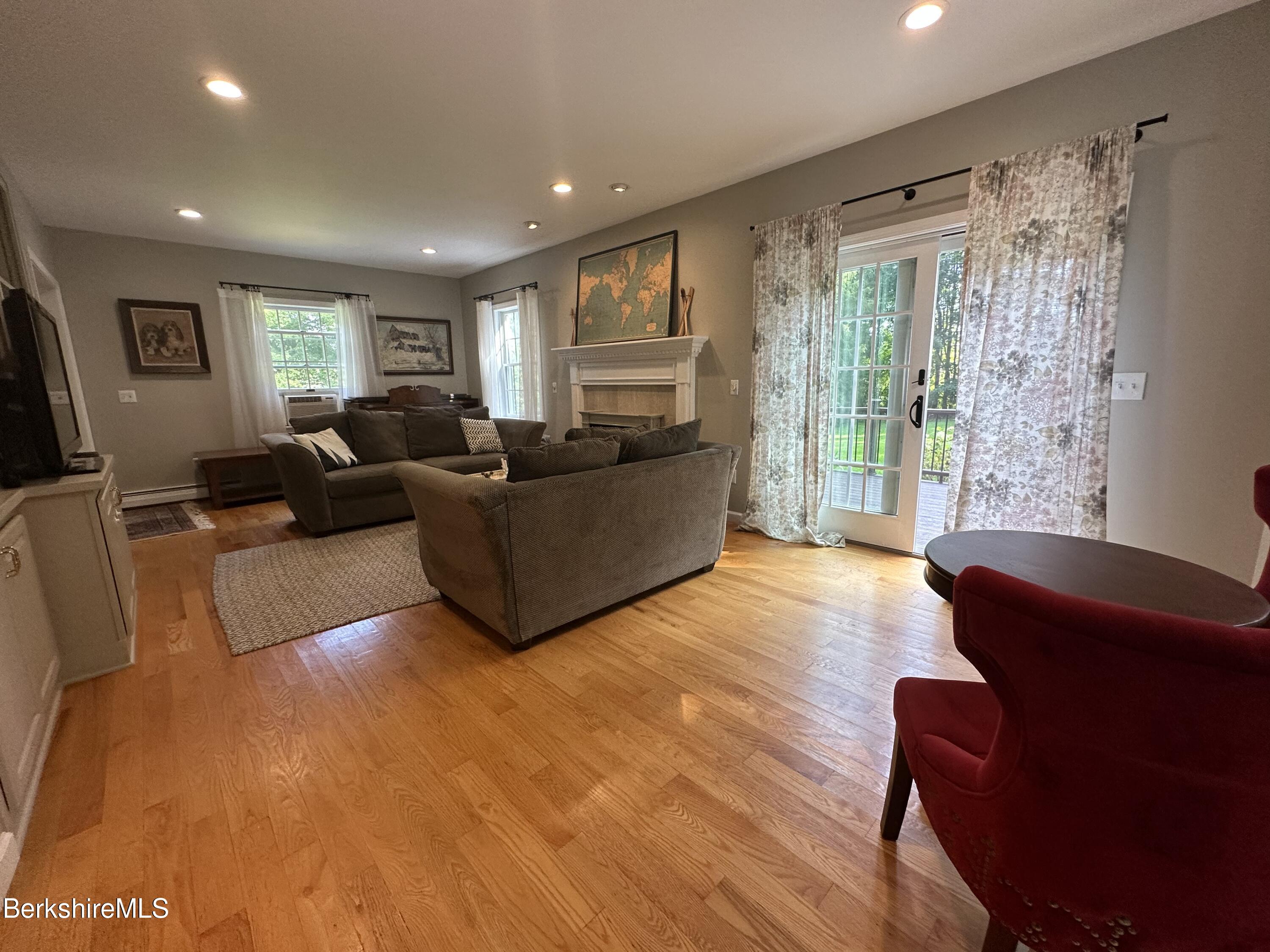 199 Old Post Road Richmond, MA 01201 - Photo 14 of 40 a living room with furniture and a large window