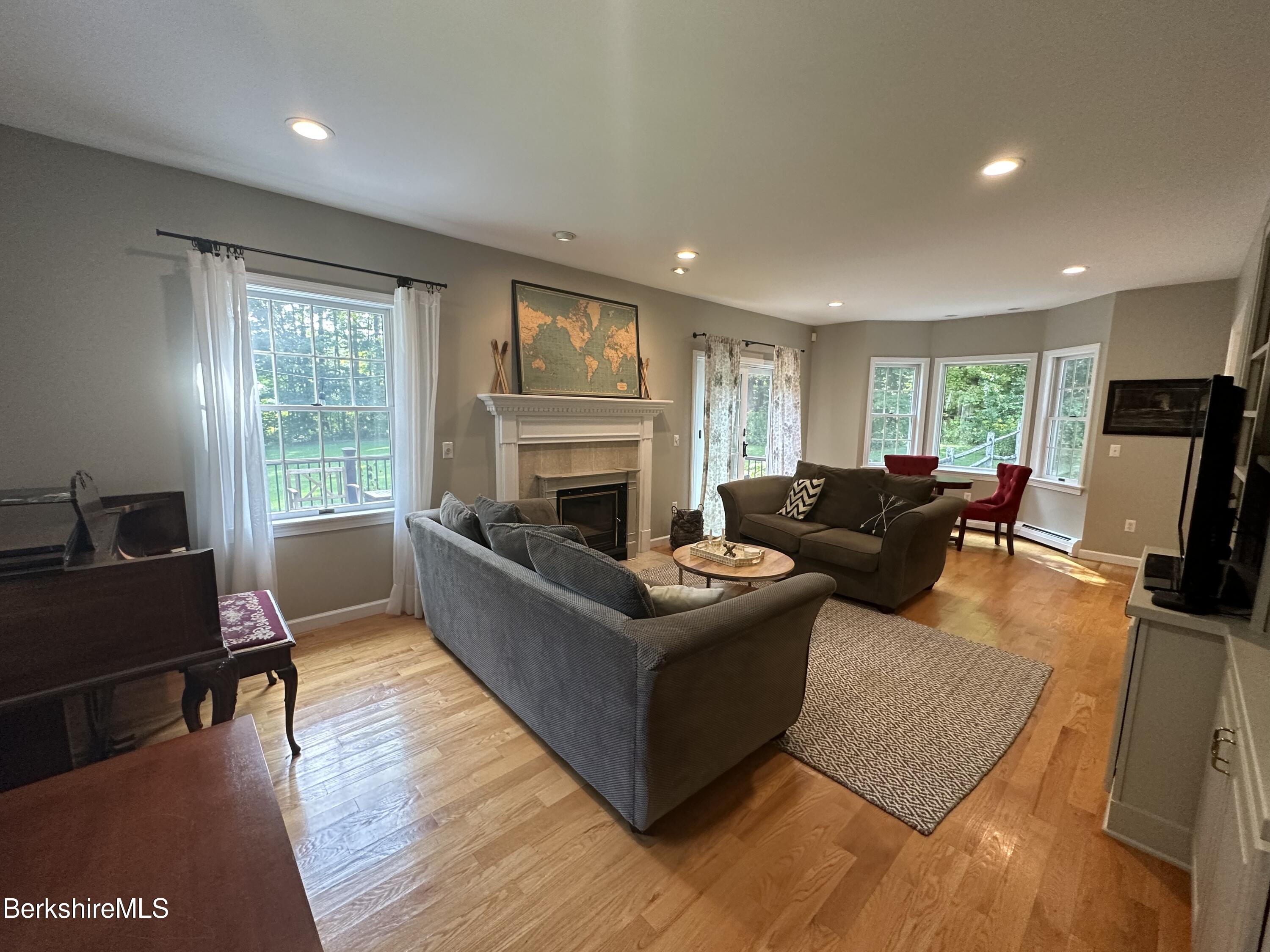 199 Old Post Road Richmond, MA 01201 - Photo 15 of 40 a living room with furniture and a fireplace